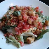House Salad · Fresh Greens topped with Cheddar Cheese, Tomatoes, Bacon and Croutons.