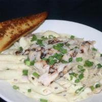 Chicken Carbonara · Grilled Chicken Breast served on a bed of Penne tossed with Bacon, Red Onion, and Mushrooms.