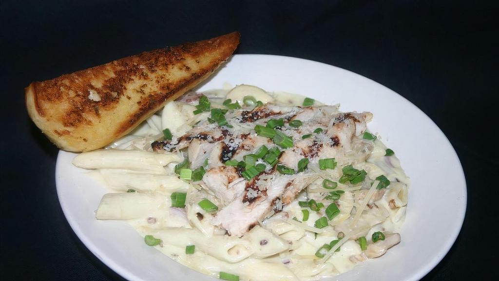 Chicken Carbonara · Grilled Chicken Breast served on a bed of Penne tossed with Bacon, Red Onion, and Mushrooms.