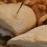 Catfish Po Boy · Fried Catfish served on a Hoagie Roll with Fried Green Tomatoes, Lettuce and Creek Sauce.