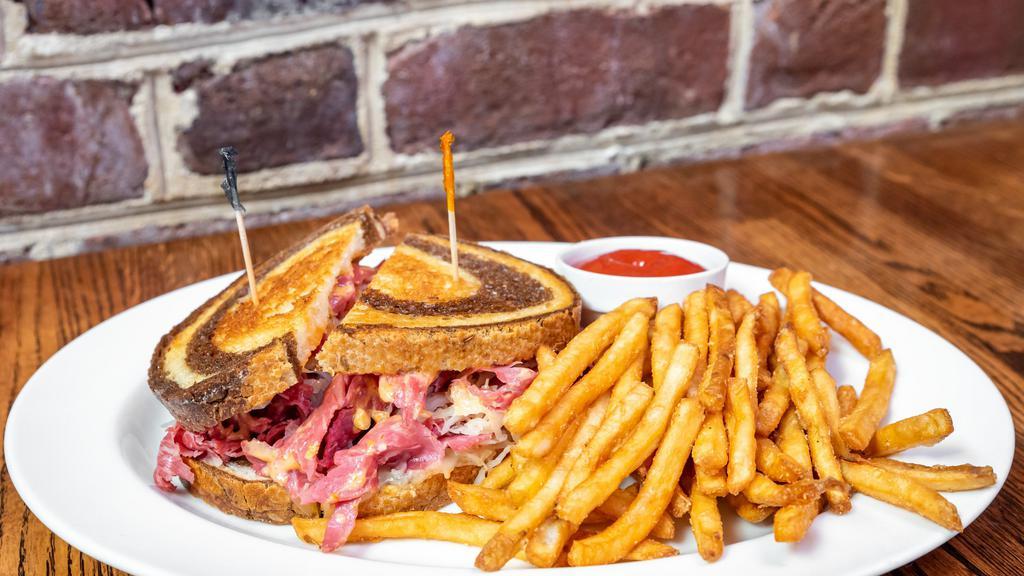 Reuben Grill · Thin slices of lean corned beef grilled with sauerkraut, topped with swiss cheese and 1000 Island dressing.