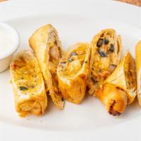 Tex Mex Egg Rolls · Served with our avocado chipotle ranch sauce.