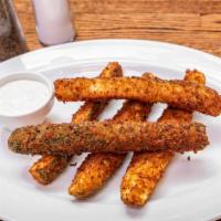 Our Signature Zucchini Sticks · Hand breaded and fried. Served with our ranch sauce.