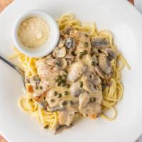 Chicken Scallopini · Sautéed chicken breast with lemon butter, mushrooms and capers served over linguini in a lig...