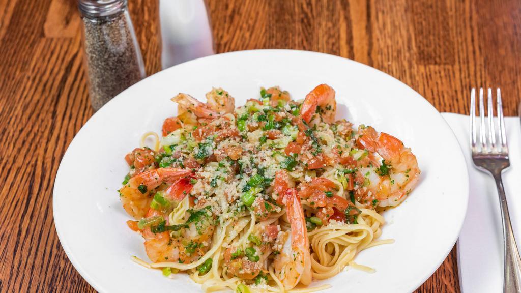 Shrimp Scampi · Shrimp, tomatoes, scallions, garlic in a lemon butter white wine sauce over linguini. Served with a Garden Salad.