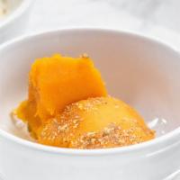 Kaddo Borani · Pan-fried and baked baby pumpkin seasoned with sugar and served on yogurt garlic sauce.