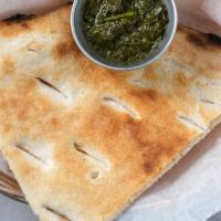 Single Naan Piece · Fresh house-made baked bread basket.