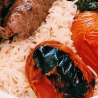 Kofta Kabob (Kubideh) · Seasoned ground beef char-grilled, served with Challow rice and side of Sabzi (spinach stew).