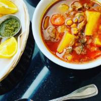Small Lamb Shurwa (Soup) · Soup consisting of slow cooked fresh Lamb, chickpeas, potatoes, carrots, coriander  and Afgh...