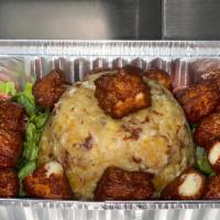 Cheese Mofongo · Fried mashed green plantains whit cheese and garlic