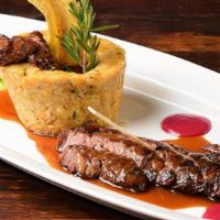 Skirt Steak Mofongo · Fried mashed green plantains whit skirt steak and garlic