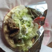 Gyro (Shawarma) · A blend of beef and lamb cooked slowly on a rotisserie.