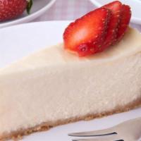 New York Cheesecake · Topped with strawberry.