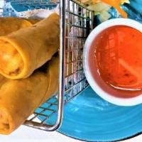 Spring Roll · Crispy vegetable roll served with sweet & sour sauce.