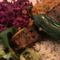 2 Skewers Adana Kobab Over Rice  · 2 skewers of Adana Kobab over rice with cabbage