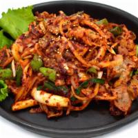 Spicy Squid & Pork Belly / 오삼불고기 · Grilled, spicy marinated squid and pork belly stir fried with sliced onions and scallions.
