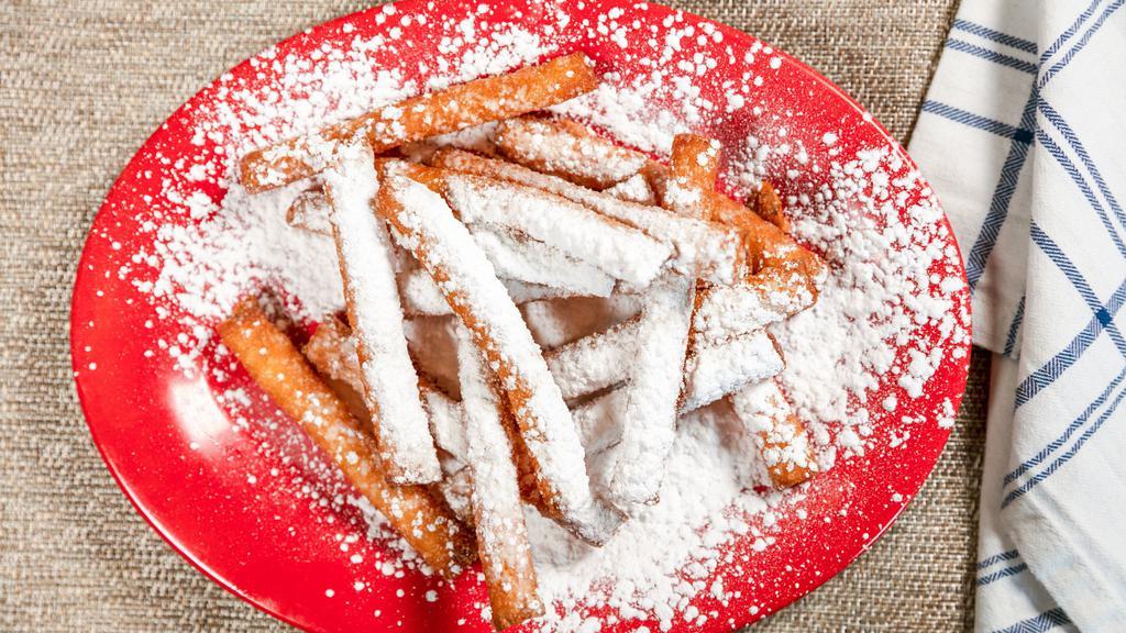 Funnel Cake Fries · A delicious funnel cake batter, doused in powdered sugar, served in 15 stick shapes.  Great to share!