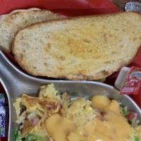 Western Mess · Ham, green pepper, onion, and cheddar cheese sauce. Get along little doggies. A skillet brea...