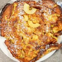 Baked Apple Pancake · A twelve inch pancake covered with three crisp, fresh apples and oven baked to a golden brow...