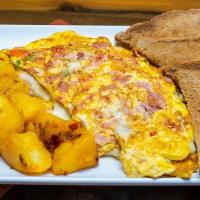 Western Omelette · Beaten eggs with tomato, ham, mozzarella, peppers & onions. Comes with toast and home fries.