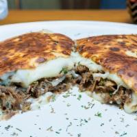 Shredded Beef Crêpe · Perfectly seasoned shredded beef with onions, and snack-mix cheese. Served with your choice ...
