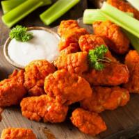Boneless Regular Buffalo Wings · Deep fried chicken wings tossed in our regular
Buffalo sauce. Comes with your choice of dip ...