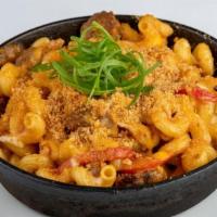 Spicy Sausage Mac And Cheese · Cavatappi pasta sautéed with Parmesan cream sauce, spicy Italian sausage, red pepper, Swiss,...
