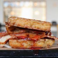 Monte Cristo · ham, smoked turkey, jack cheese, on a french toast biscuit, strawberry preserve