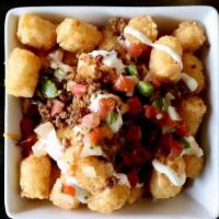 Taco Style-Tater Tots · house-made cheese sauce, taco meat, pico de gallo, sour cream