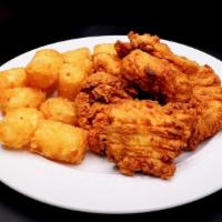Chicken Nuggets · 6 chicken nuggets, served with tots or apple sauce