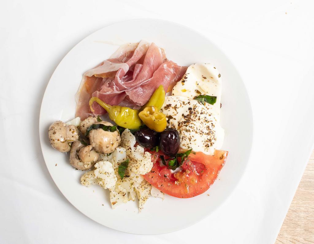Antipasto · Prosciutto di Parma, our fresh homemade mozzarella cheese with marinated mushrooms, tomato slices, basil, owner’s olives, giardiniera and owner’s extra virgin olive oil.