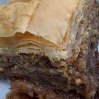 Baklava · Walnuts and cinnamon wrapped in phyllo dough soaked in a light syrup.