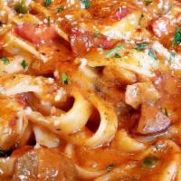Mardi Gras Pasta · Shrimp, andouille sausage, chicken, mushroom, marinara cream sauce.