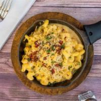 Smoked Gouda Mac & Cheese  · Gruyere bechamel sauce topped with smoked gouda, applewood smoked bacon and toasted herb bre...