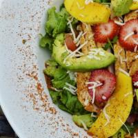 Mango Chicken Salad · Fresh salad greens with sliced, grilled chicken paired with roasted corn and black bean sals...