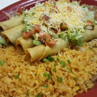 Flautas De Pollo (3) · Seasoned chicken filled inside corn tortillas and lightly fried, topped with guacamole, pico...