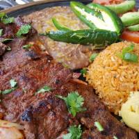 Carne Asada Platillo · Eight ounces of butterfly steak grilled with onions, served with cilantro, sliced tomatoes, ...