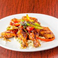 Lanna Wings · Fried chicken wings with basil and bell pepper sautéed in house special sauce.
