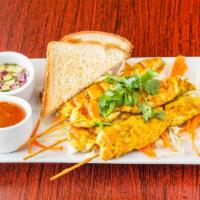 Chicken Satay · Chicken marinated in spices and coconut milk. Served with creamy peanut sauce and Thai cucum...