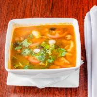 Tom Yum · Soup made with lemongrass, kaffir lime leaves, galangal, Thai chili paste, onions, mushroom,...