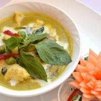 Green Curry · Eggplants, bell peppers, Thai basil, green curry paste with coconut milk.