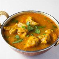 Chicken Curry · Boneless chicken pieces cooked with curry spices.
