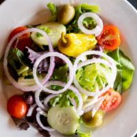 House · Romaine, iceberg, tomatoes, cucumbers, red onions, olives, pepperoncinis, house Italian dres...