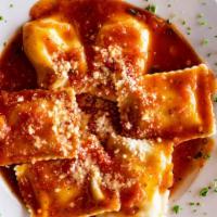Cheese Ravioli · Topped with tomato sauce.