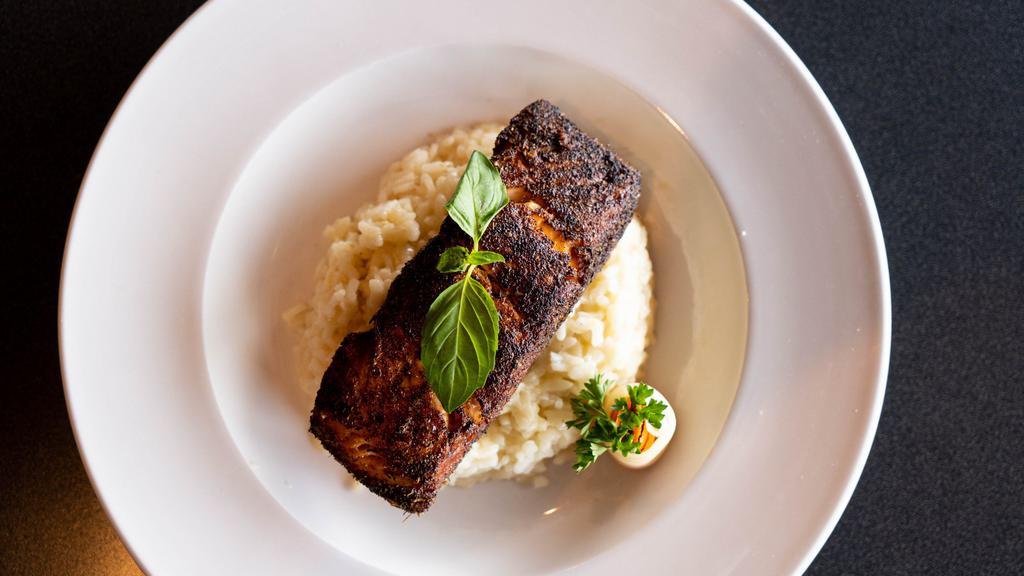 Salmon Nicola · Fresh salmon filet baked with butter and basil served with creamy parmigiana risotto.