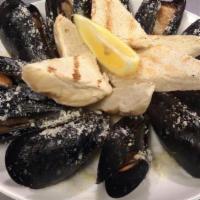 Garlic Mussels · Pei mussels steamed in garlic butter and white wine. Served with seasoned French bread.