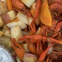 Cajun Steamer · Crawfish and gulf shrimp served with a blend of spicy vegetables (carrots, onions, potatoes).