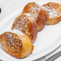 French Toast · Served with butter, syrup and powdered sugar all on the side.