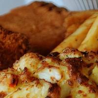 Seafood Platter · 4 oz. broiled crab cake, crispy founder & breaded jumbo shrimp served over fries Comes with ...