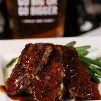 Homemade Spicy Meatloaf* · classic meatloaf with a kick, gravy, mashed potatoes, veggie du jour